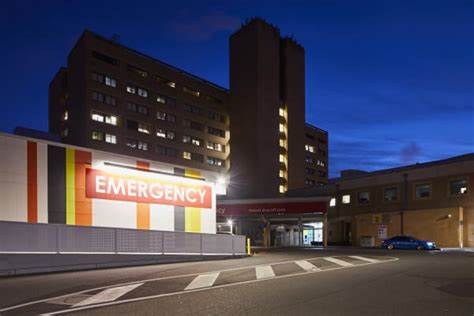 Large, illuminated Emergency sign outside the entrance to the Canberra Hospital.