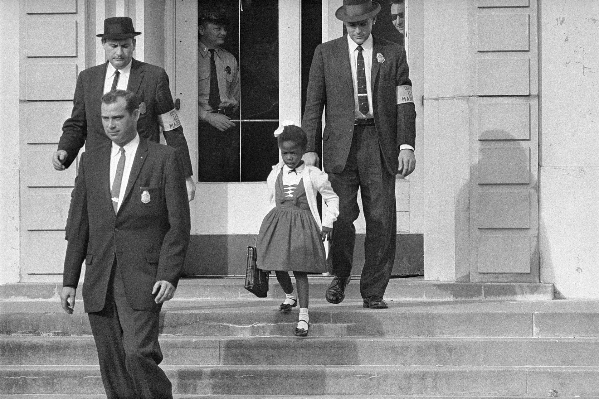 6-year-old Ruby Bridges protected by U.S. Deputy Marshals at William Frantz Elementary School in New Orleans, November 1960. (AP Photo/File)