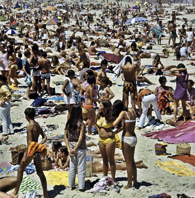 People at the beach in the early 1980s.