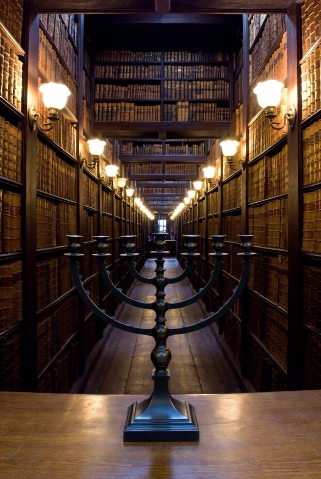 A menorah in a library, representing the contribution of Jewish contributions to humanity.