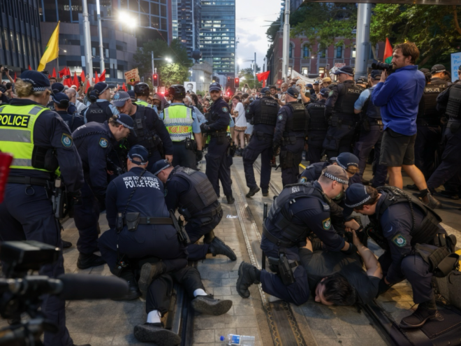 Anti-Herzog protesters and NSW Police, 9 February 2026, outside Sydney Town Hall.